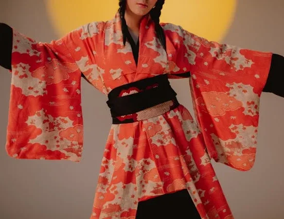 Young woman wearing traditional Japanese furisode kimono with long swinging sleeves at Coming-of-Age ceremony