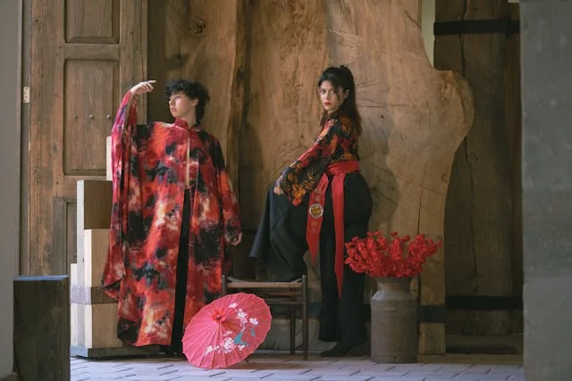 Traditional Japanese Clothing, Woman wearing traditional Japanese kimono with cherry blossom sakura pattern in spring garden