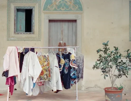 Traditional Japanese kimono displayed with layered silk robes, showcasing the T-shaped construction and seasonal color patterns of ancient Japanese clothing
