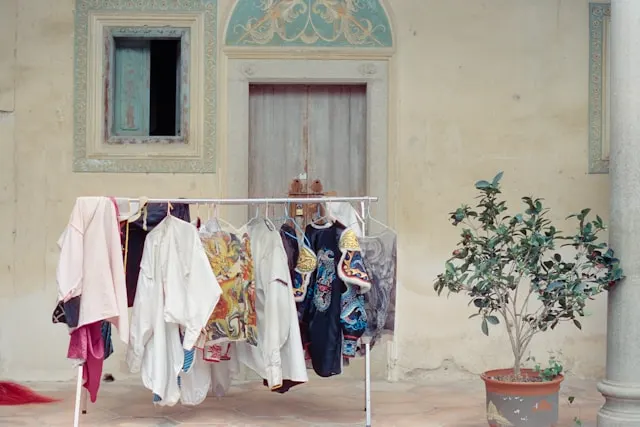 Traditional Japanese kimono displayed with layered silk robes, showcasing the T-shaped construction and seasonal color patterns of ancient Japanese clothing